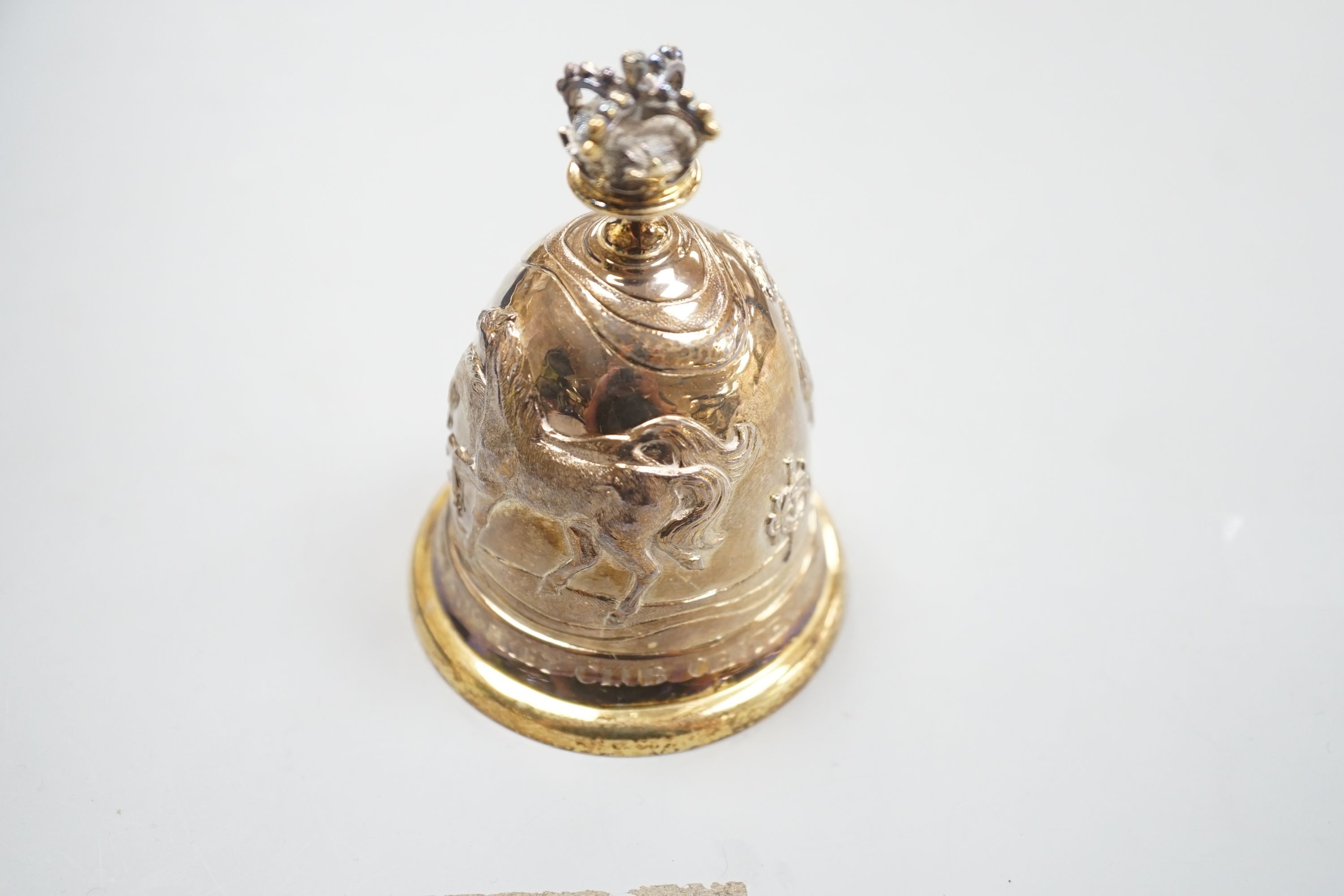 A cased modern embossed silver gilt hand bell, with engraved inscription, 'The Royal Hong Kong Jockey Club Centenary, 1884-1984', Garrard & Co, London, 1985, 94mm, 126 grams.